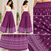 Close-up of purple palazzo pants with white motifs and decorative hem